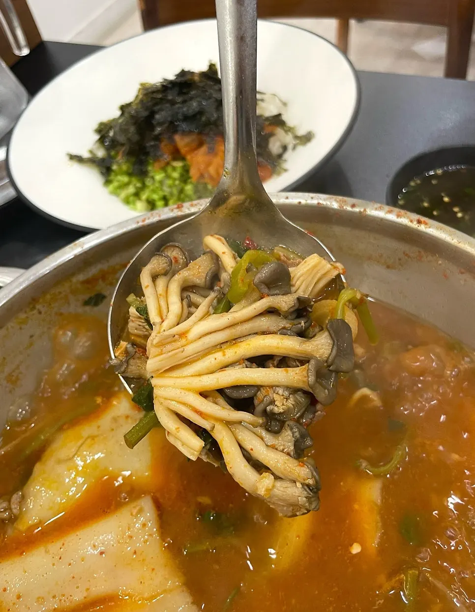 Flat kalguksu eaten with meat