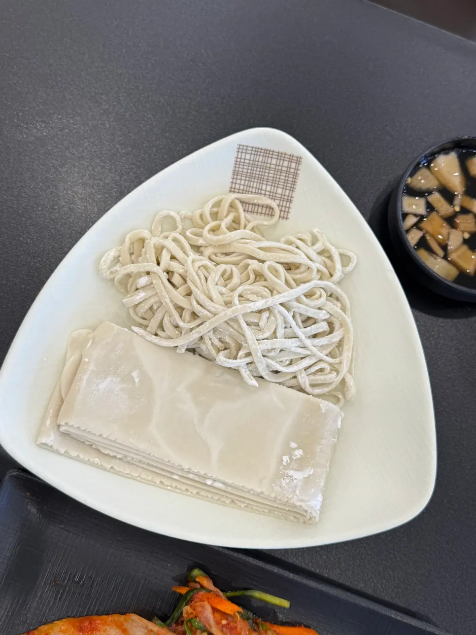House-made kalguksu noodles pulled fresh at the restaurant