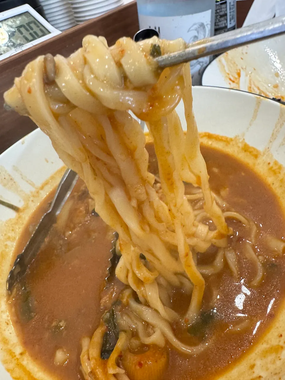 Kalguksu noodles boiling in the broth