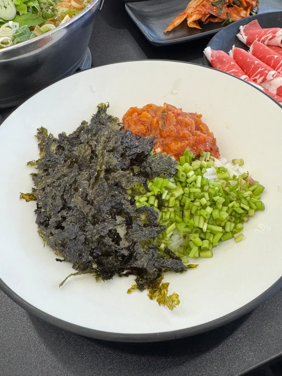 Finishing fried rice cooked in the pot