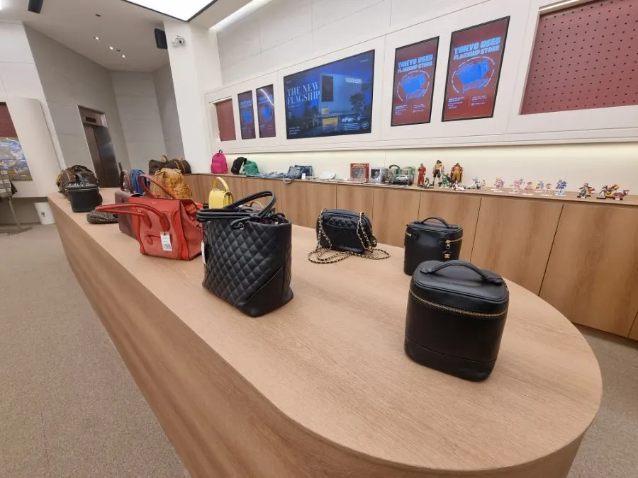 Store corner with bags and small items displayed together