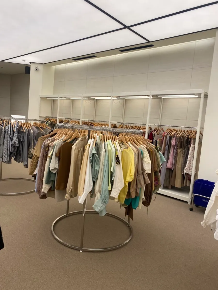 Bags displayed with condition notes and price tags