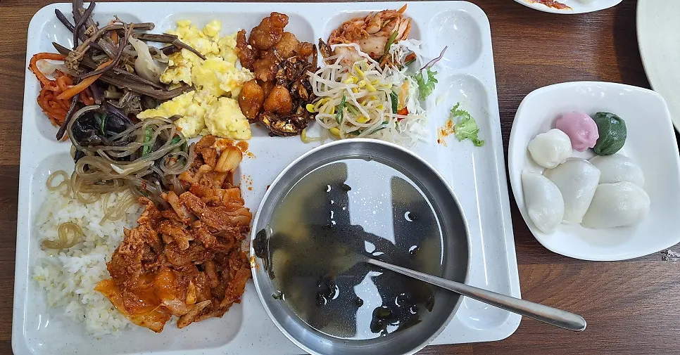 A full buffet tray mid-meal