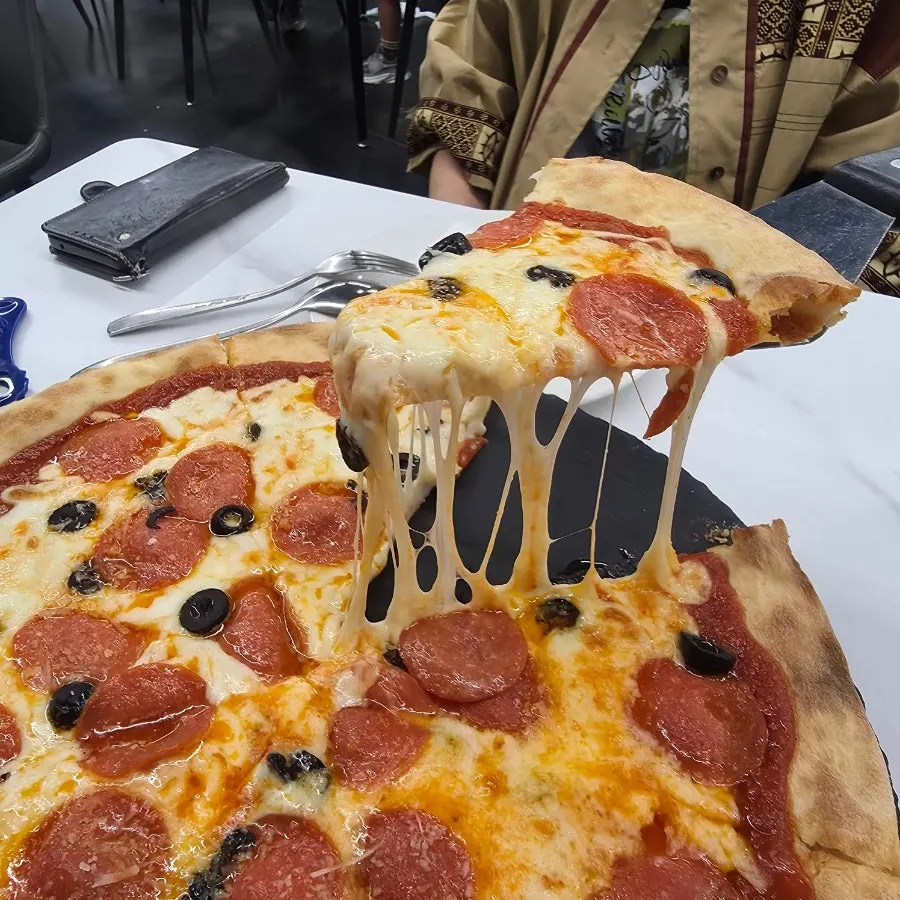 Cross-section showing the chewy pizza dough