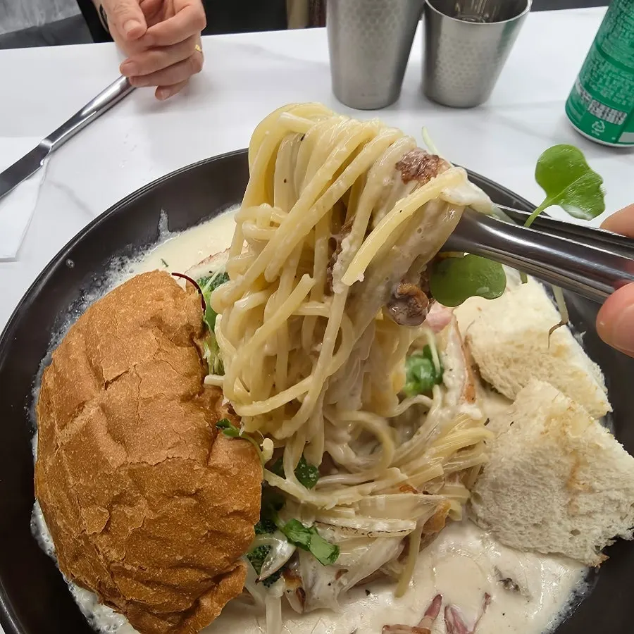 Cream pasta served together with pane bread