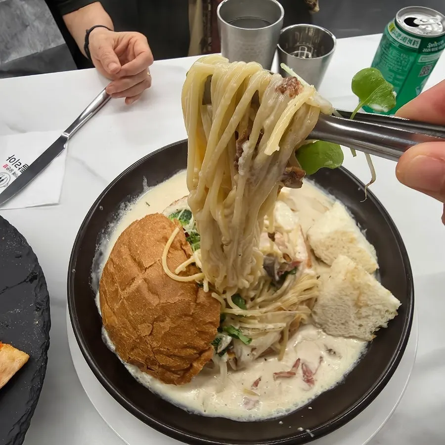 Pasta noodles coated in cream sauce