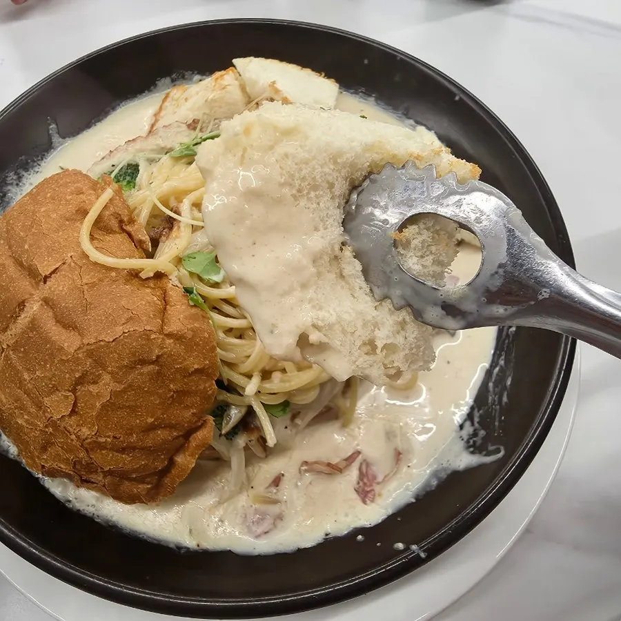 Pane bread served alongside the cream sauce