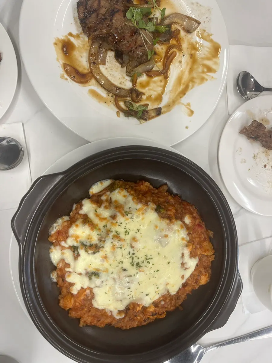 Tomato chicken cheese risotto with chicken pieces