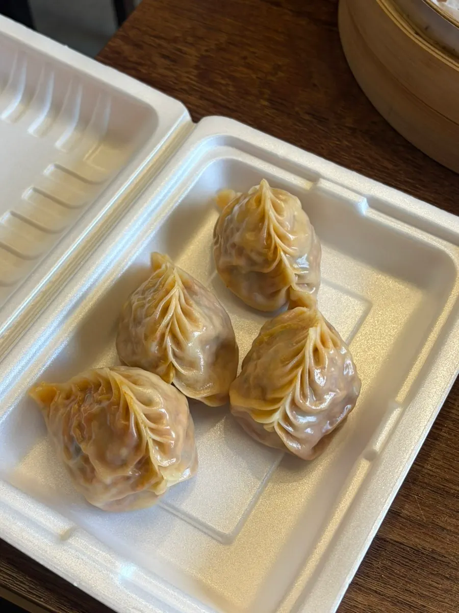 Plate with 4 remaining steamed dumplings