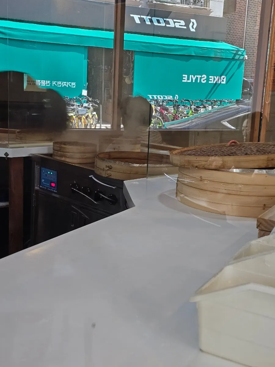 Open kitchen showing the house noodle-making process