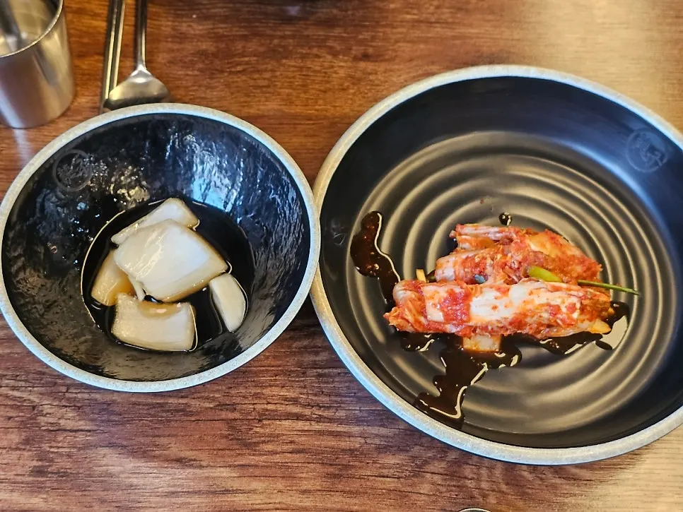 Basic side dishes of pickled onions and napa cabbage kimchi