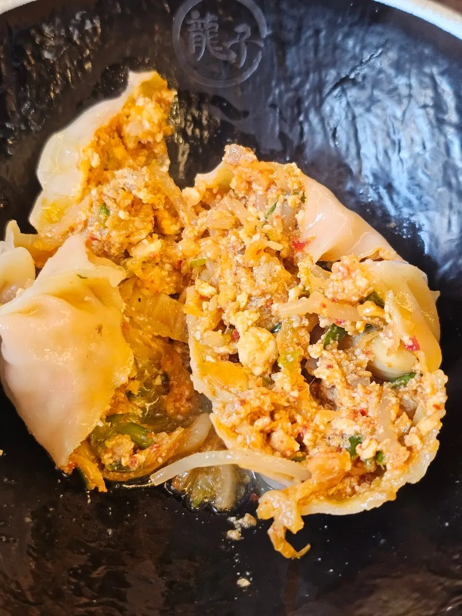 Cross-section of a large dumpling inside kalmandu-guk