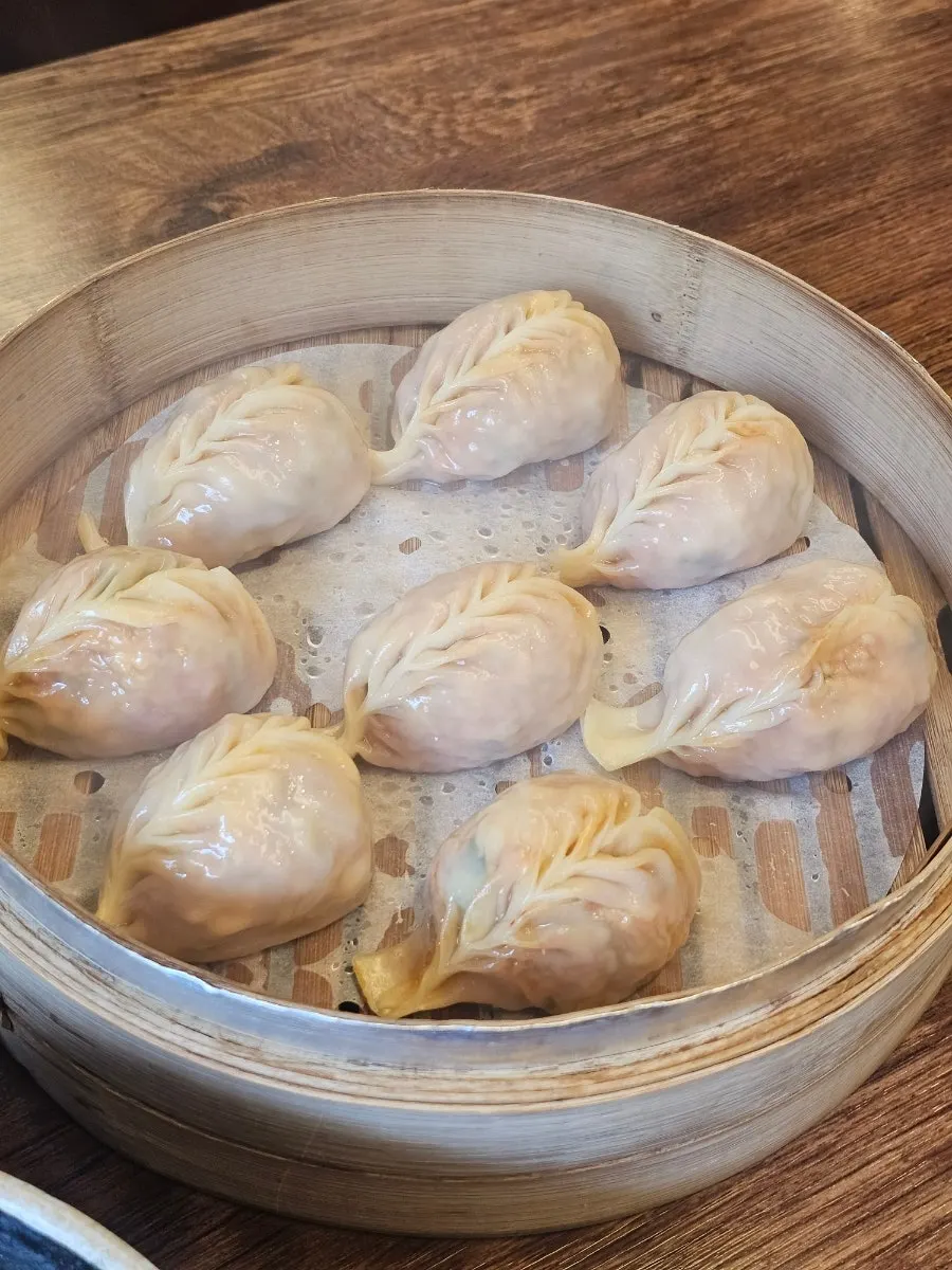 Plate of steamed dumplings served fresh after ordering