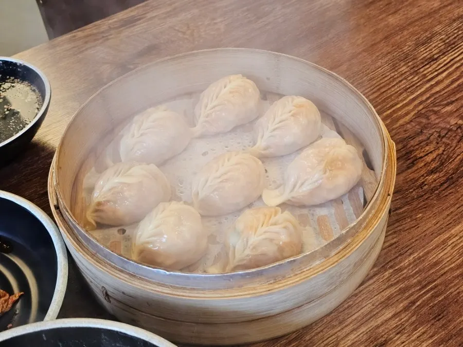 Steaming hot dumplings fresh out of the steamer