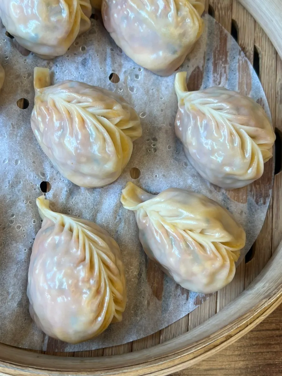 Kimchi steamed dumplings with thin wrappers and full filling