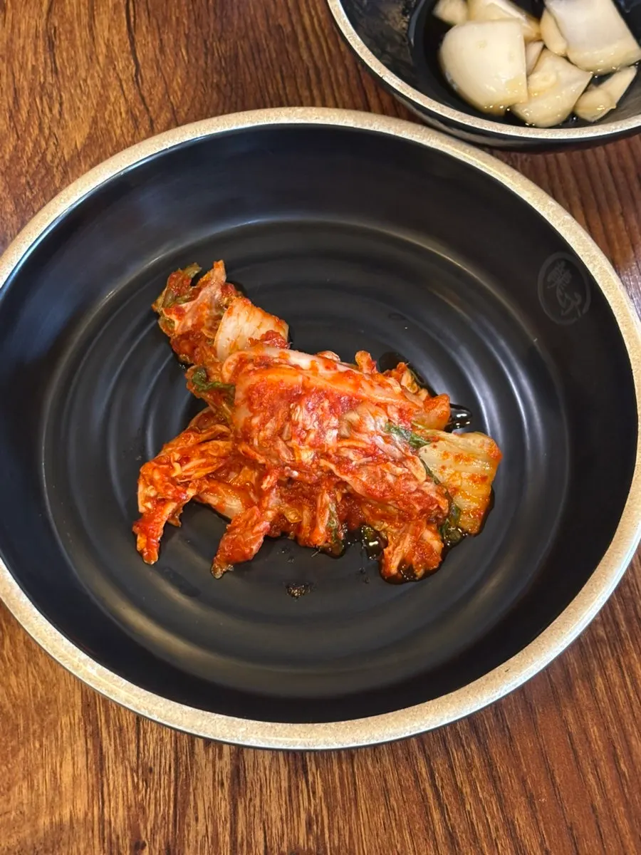 Kimchi set out at the self-service side dish bar