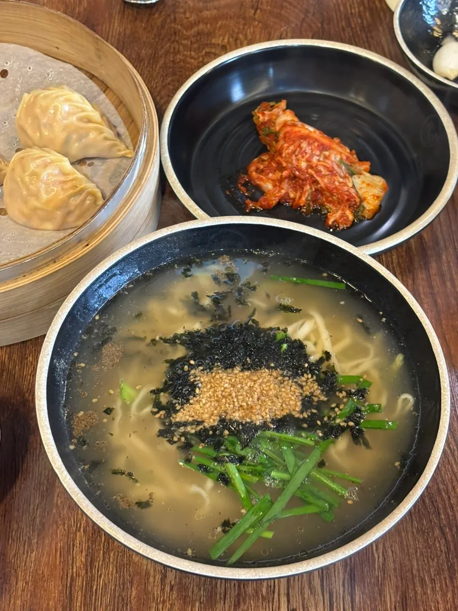 A plate of steamed kimchi dumplings, 8 pieces