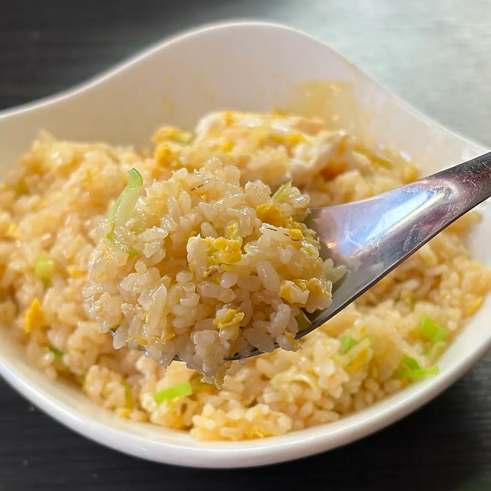 Egg fried rice mixed together after breaking the yolk