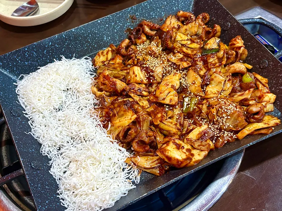 Close-up of spicy octopus with a smoky open-flame char