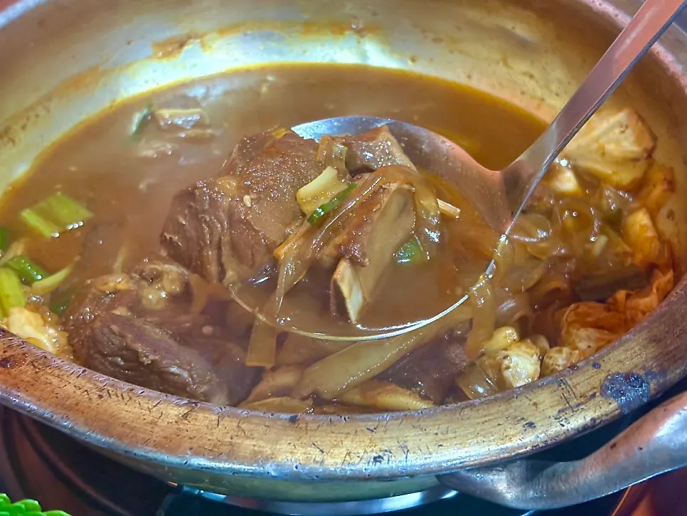 A piece of rib coated in sweet sauce