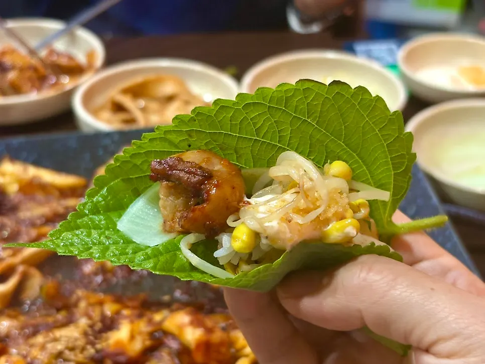 Octopus and flying fish roe wrapped in a perilla leaf
