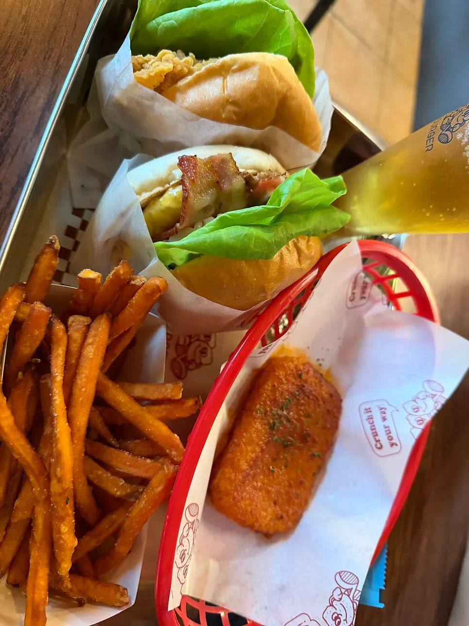 Vertical photo of the craft beer glass and burger table