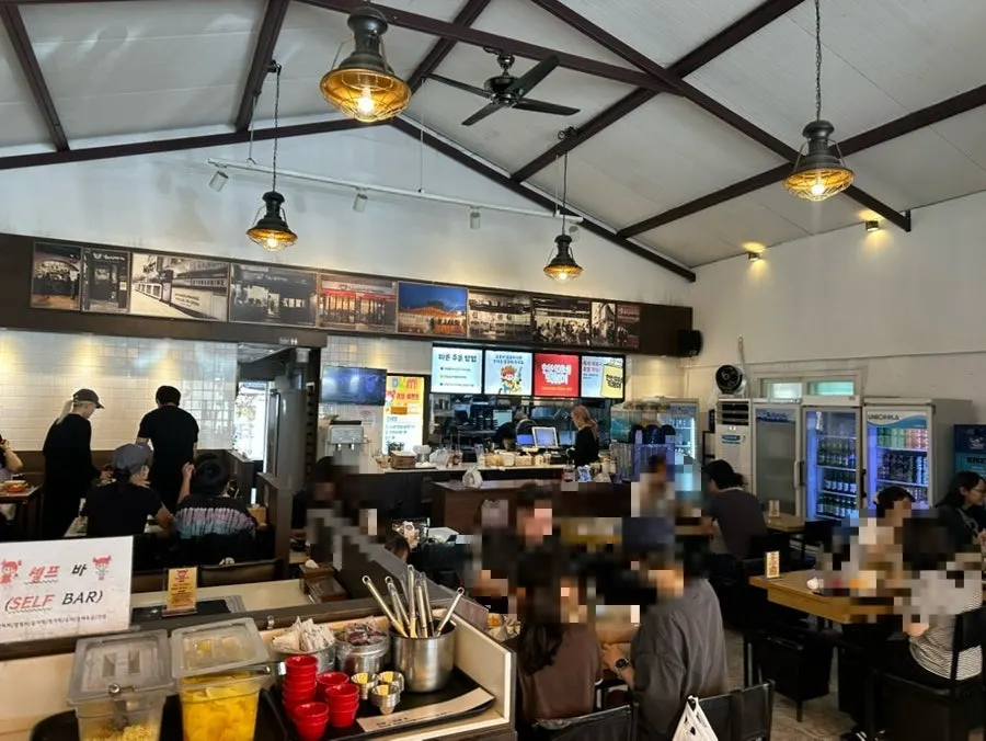 Korean snack restaurant interior with four-person tables