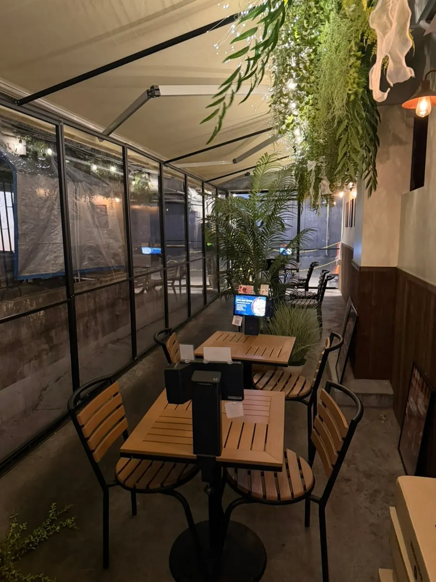 Spacious restaurant interior with seating farther inside
