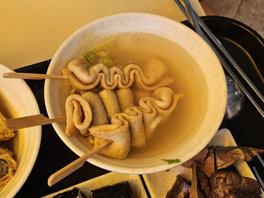 Three curly fish-cake skewers at Hyeonseonine