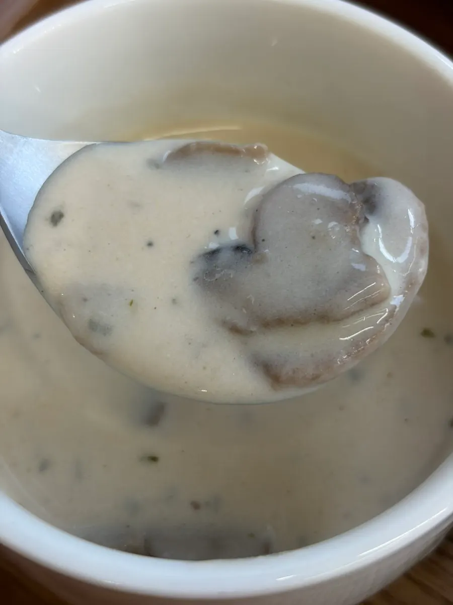 Dipping morning bread into mushroom soup