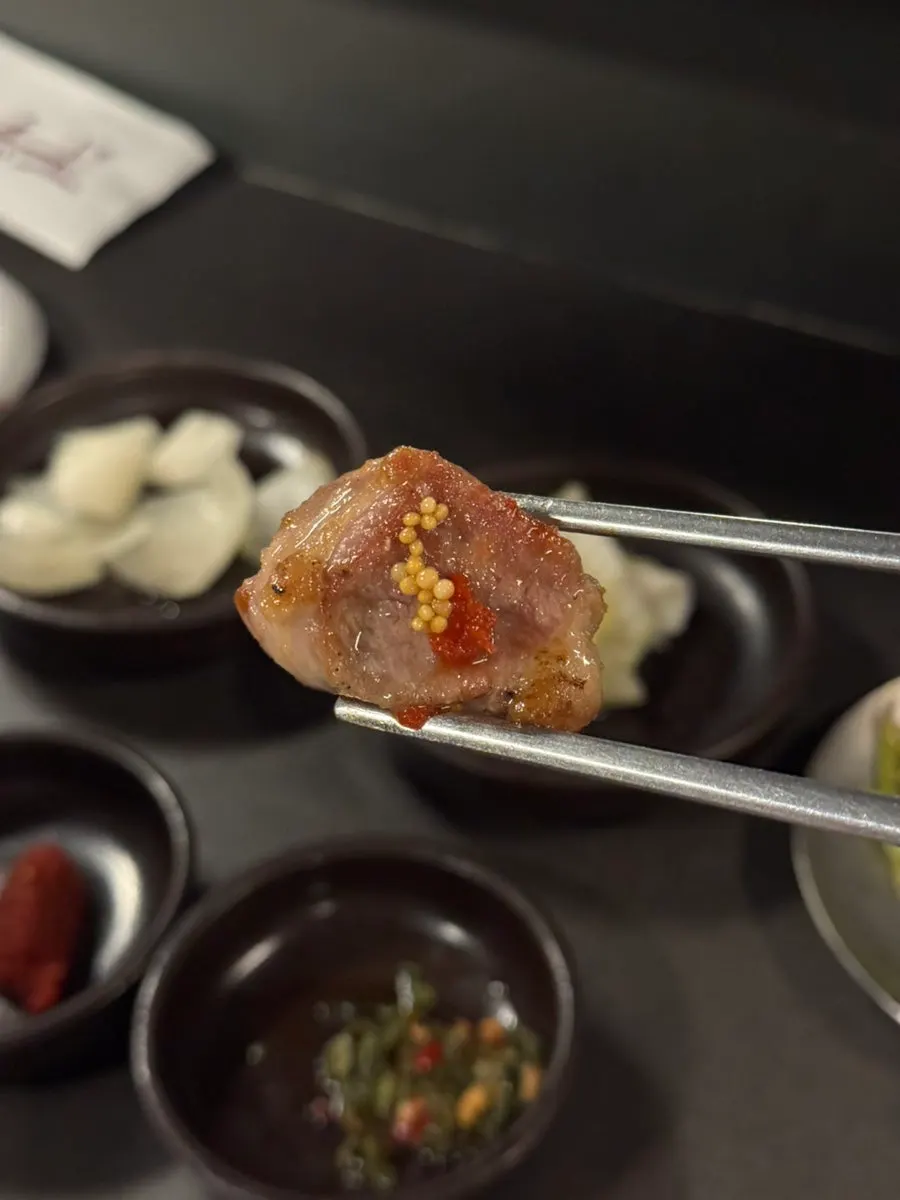 Fermented pork neck eaten with the house sauces