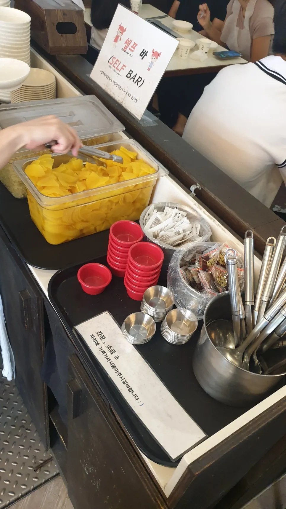 Hyeonseonine's self-serve bar with pickled radish and soy sauce