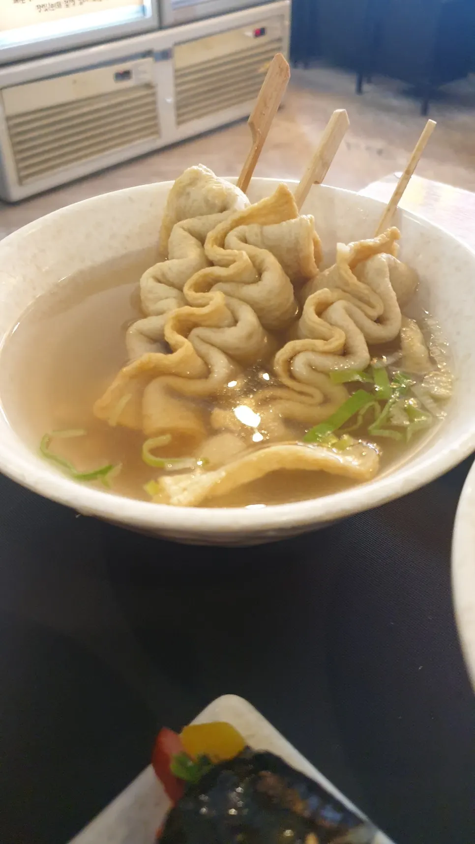 Three pieces of odeng served with broth