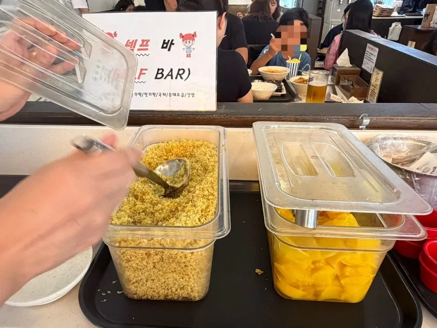 Pickled radish and sauces at the Hyeonseonine self-bar
