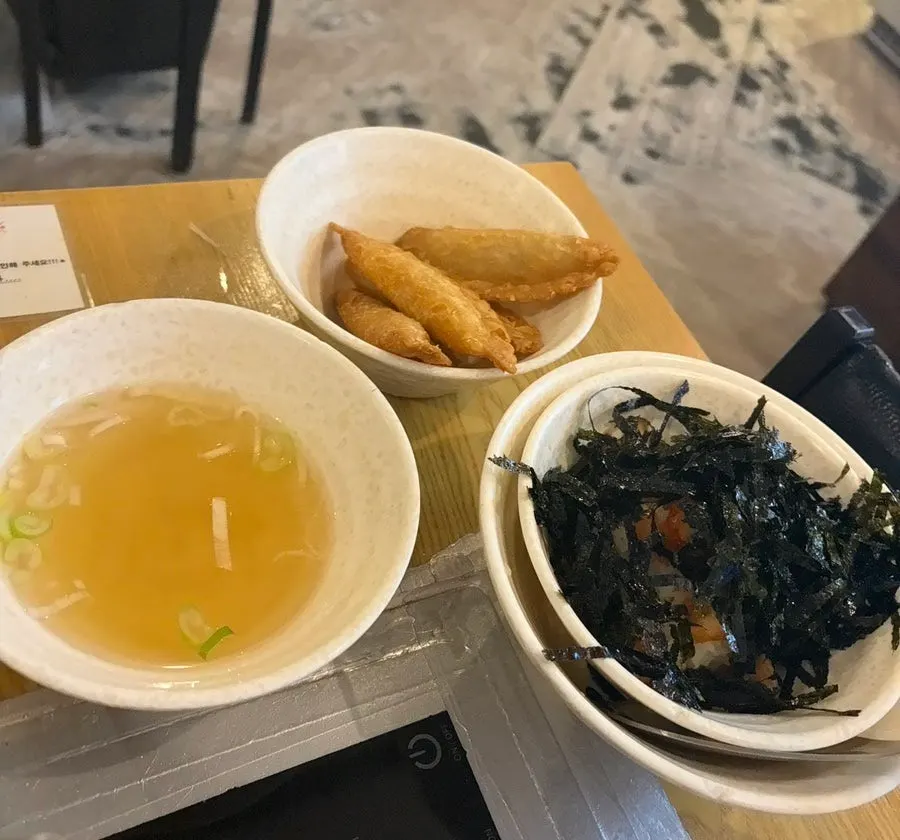 Table spread with yakimandu and a boiled egg