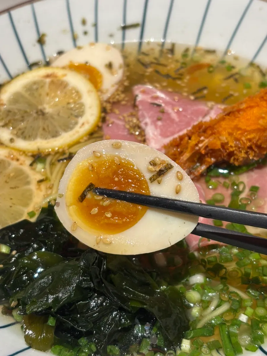 Soft-boiled seasoned egg on the chilled ramen