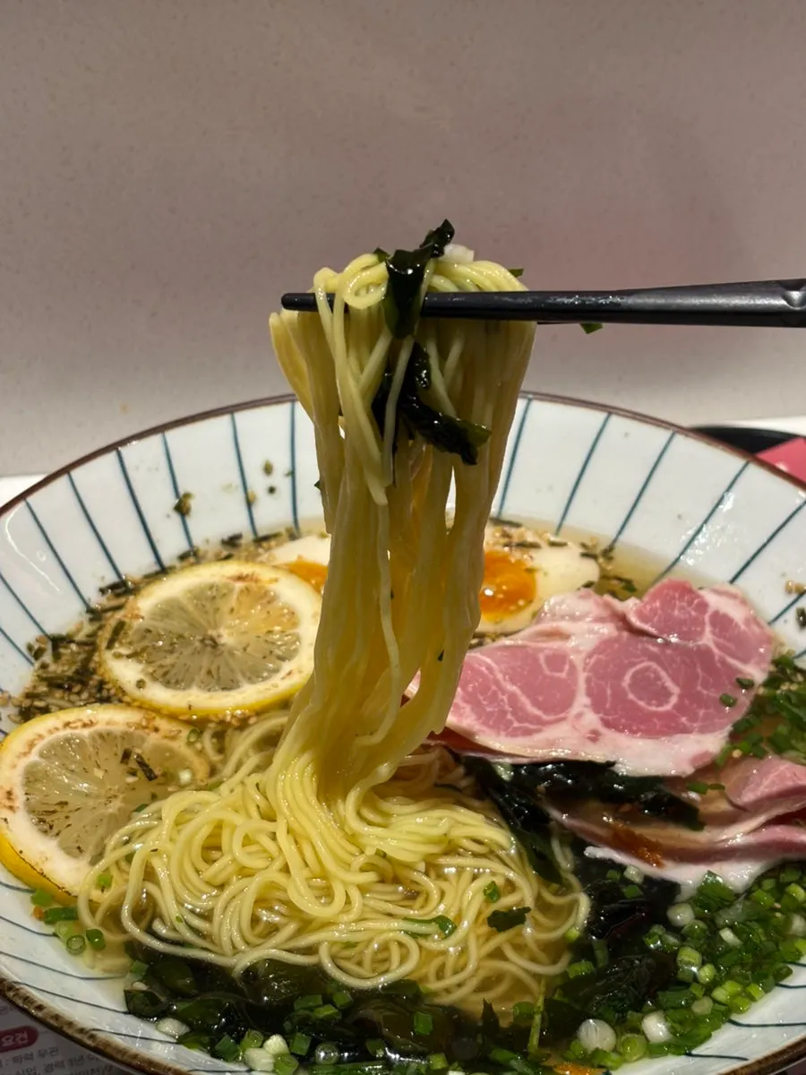 Picking up noodles from the chilled ramen