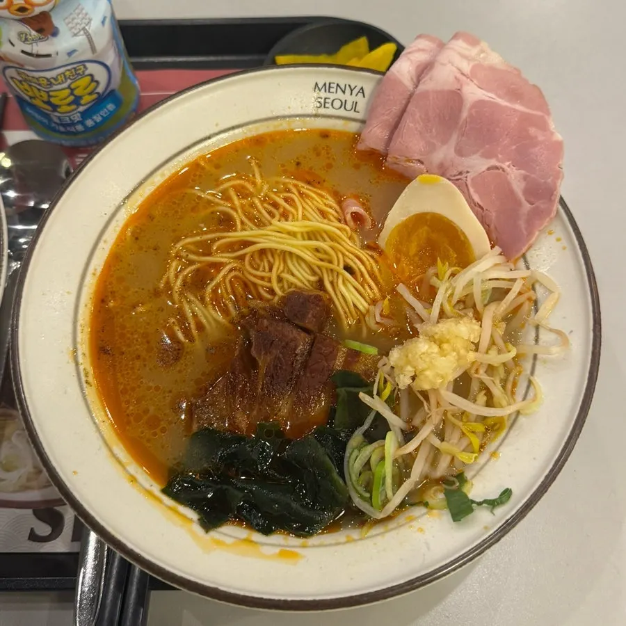 Broth and noodles in dongpo pork chashu ramen