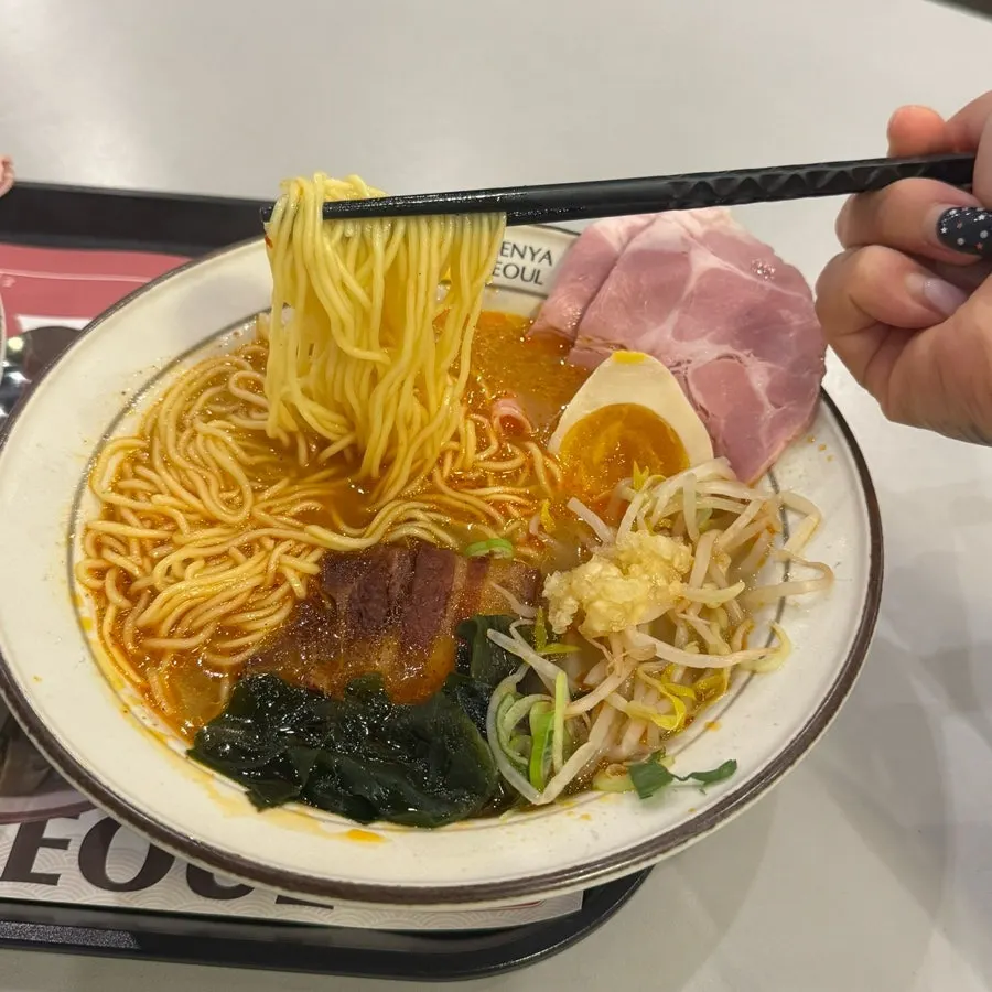 Broth and noodles in dongpo pork chashu ramen