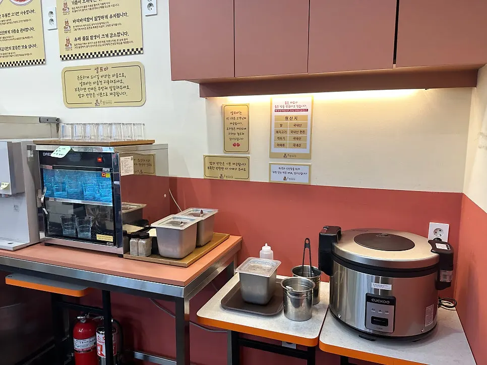 Sign about the steam-injection fryer near the kitchen area