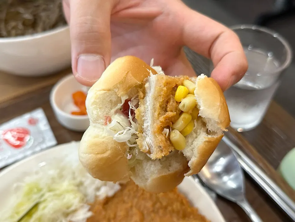 Cross-section of the pork cutlet with sweet sauce drizzled on top