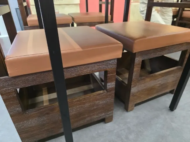 Seats with bag storage space underneath the chairs