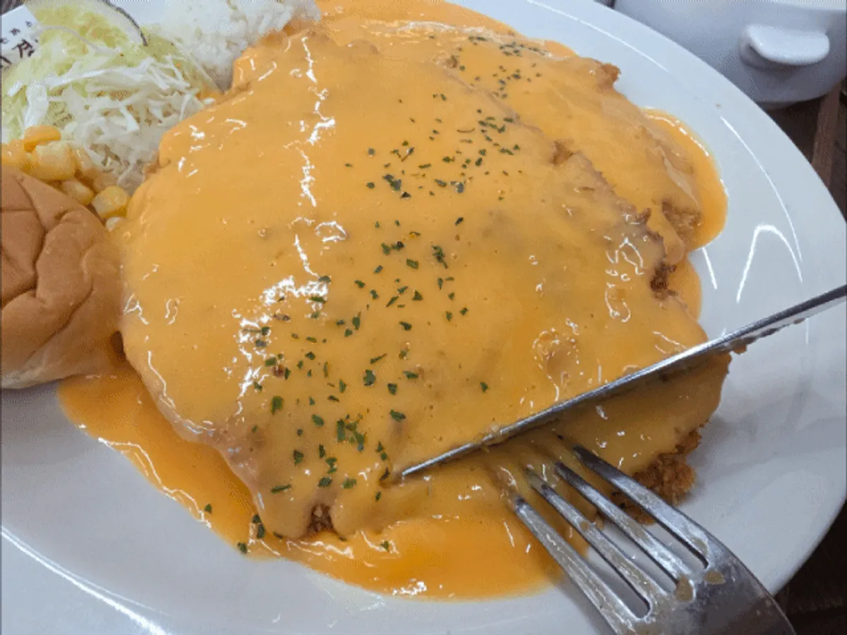 Cheddar cheese cutlet with cheese overflowing