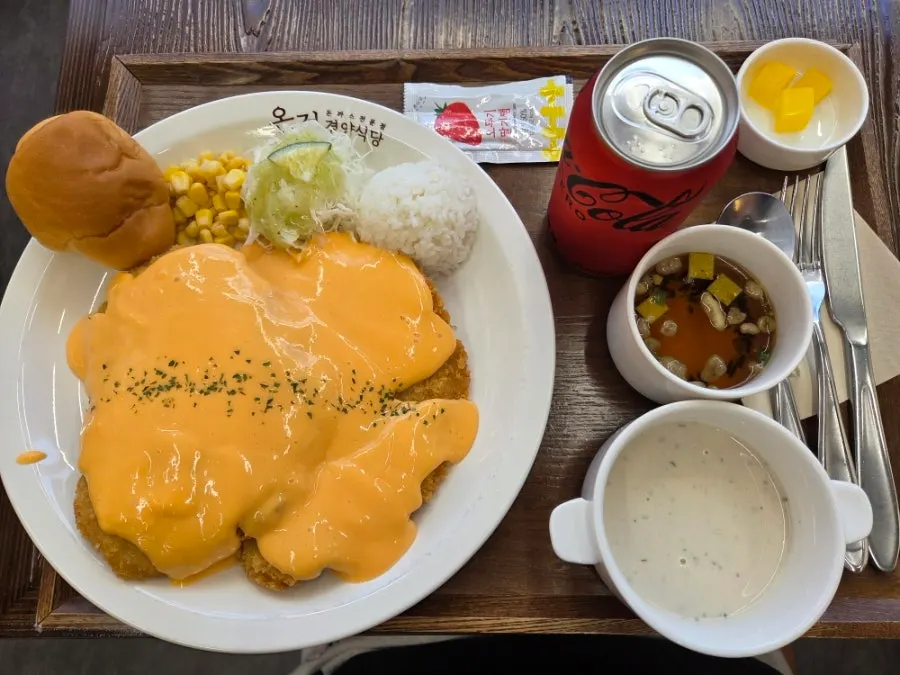 A plate of cheddar cheese pork cutlet