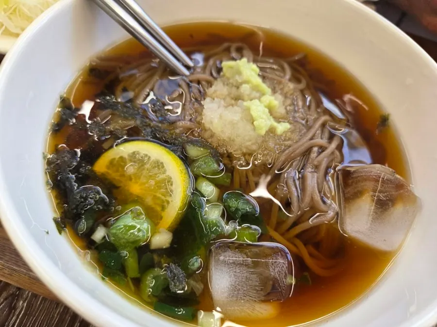 Dipping noodles into the cold soba broth