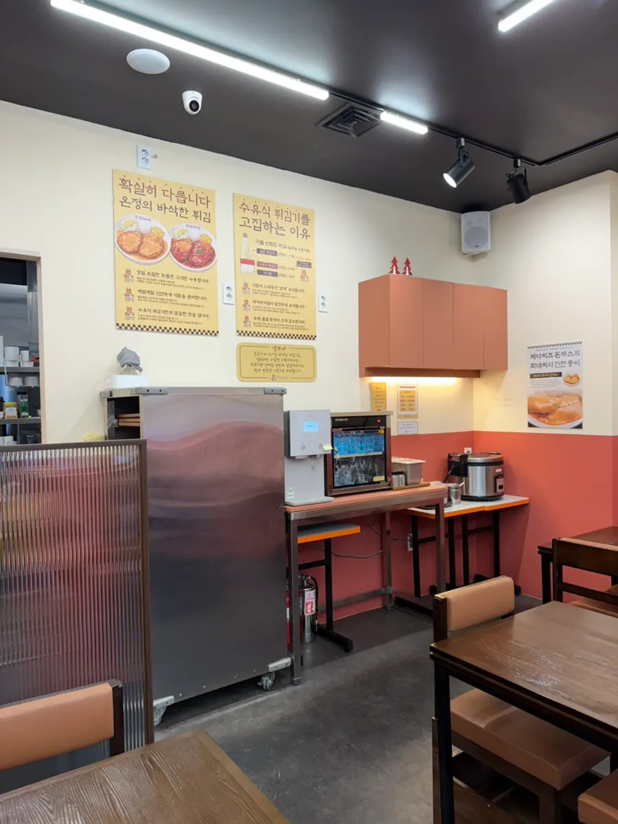Exterior of the handmade pork cutlet restaurant with an orange sign
