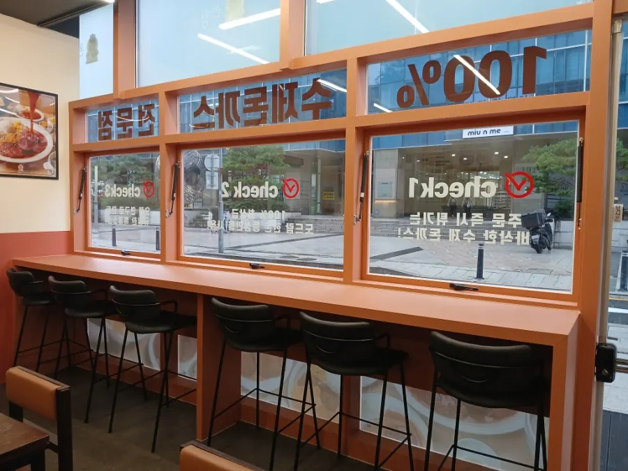 Interior with window seats and a bar table