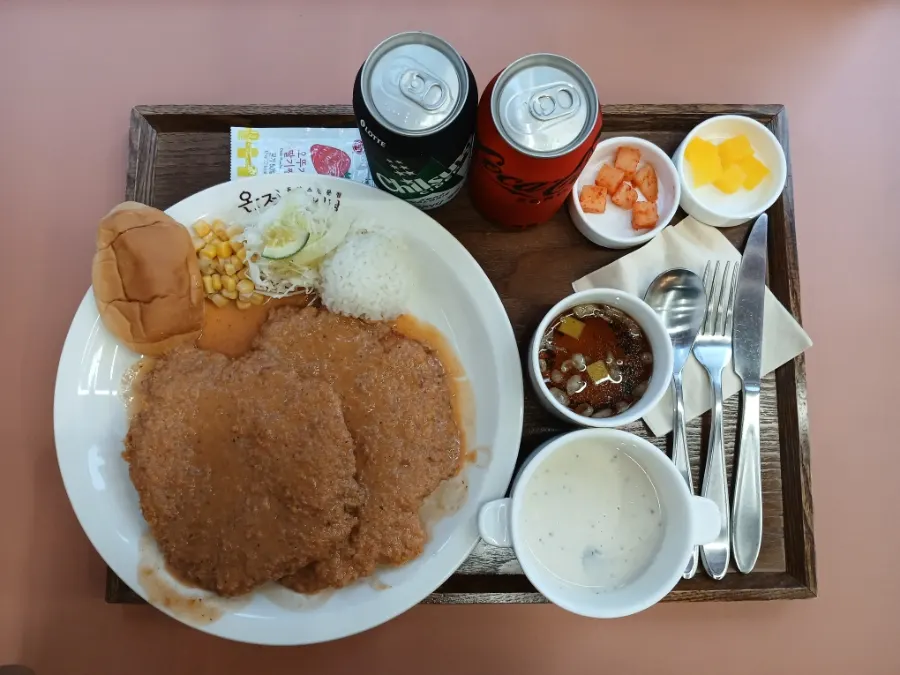 Full table setting of the single Western-style pork cutlet dish