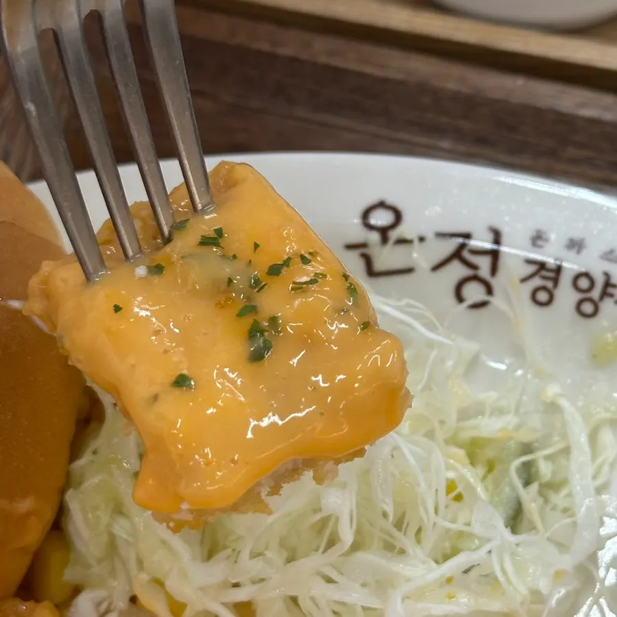 A piece of handmade pork cutlet made with Doduram Korean pork