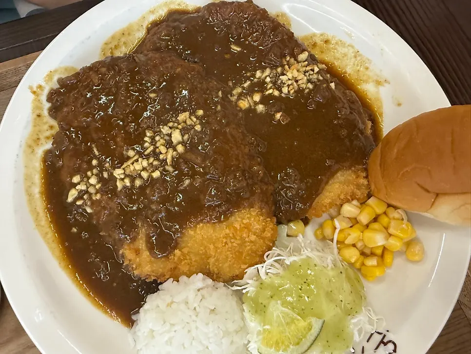Cross-section of the cheddar cheese pork cutlet with sauce